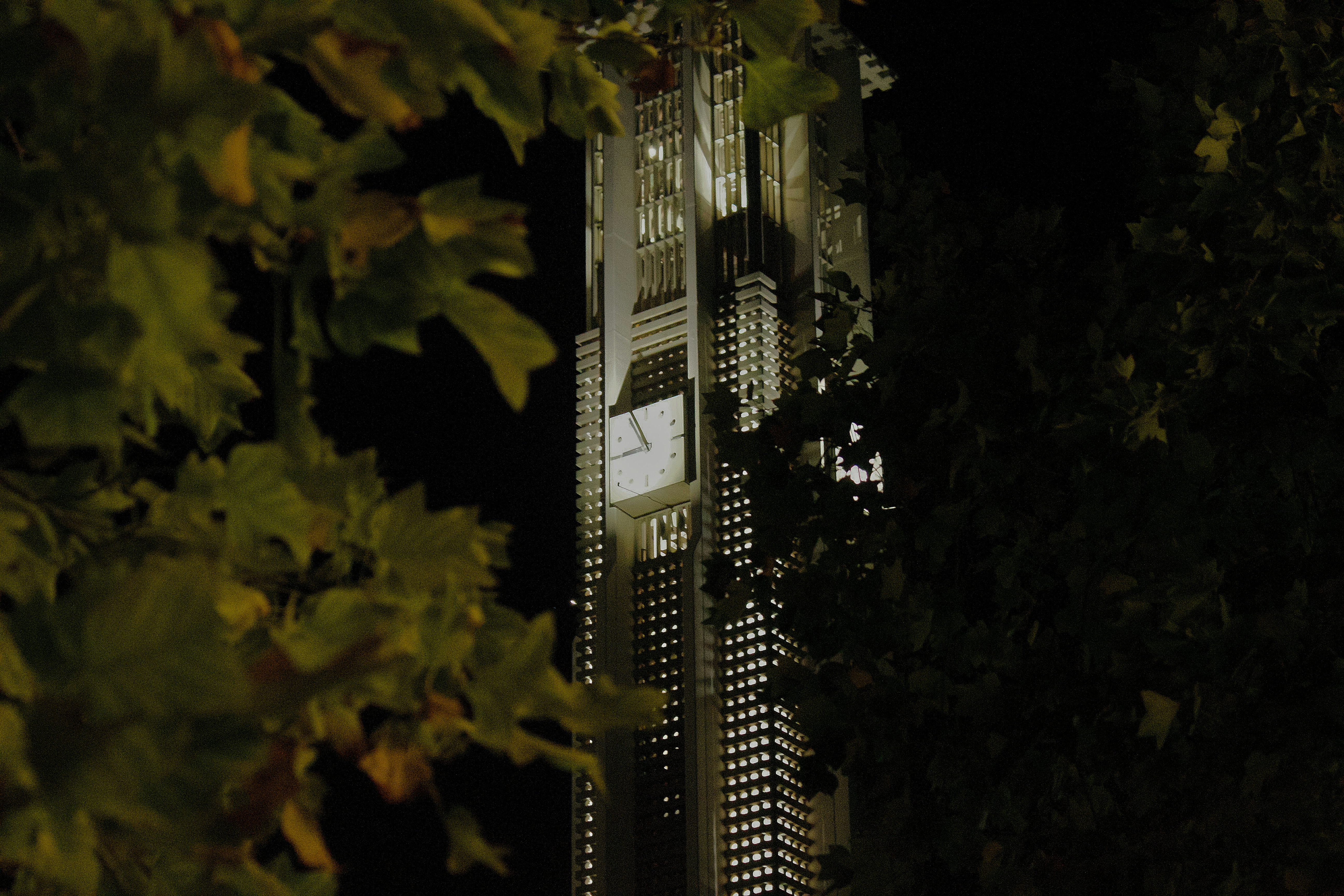 A tall clock tower towering over a city at night photo – Free Ucr Image ...