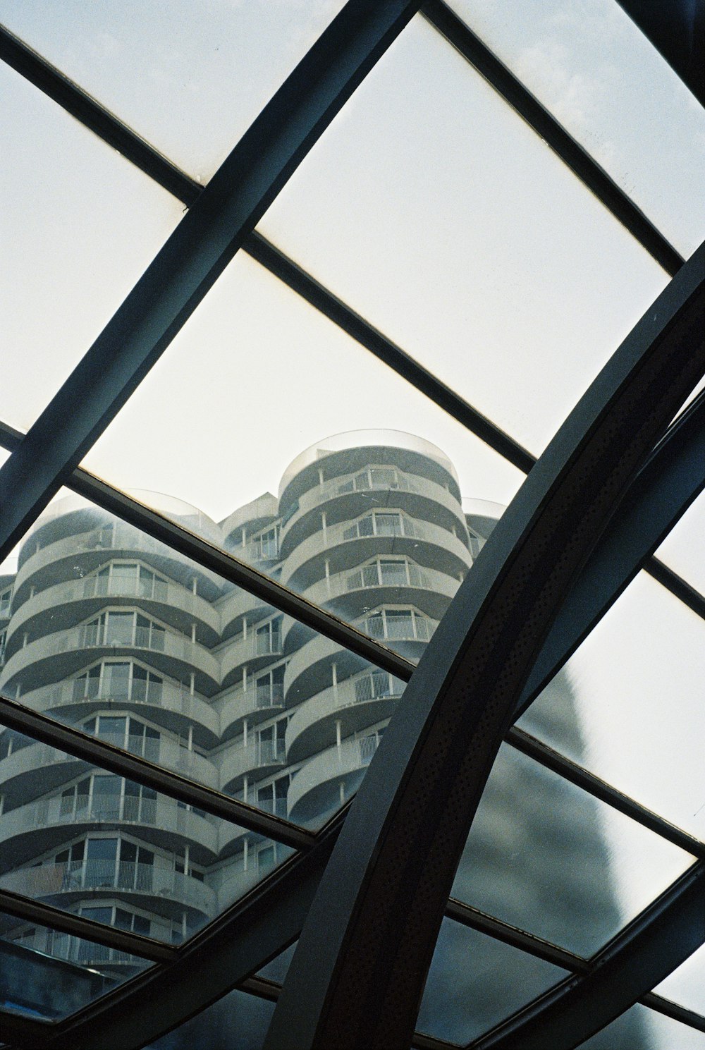 a view of a building through a metal frame