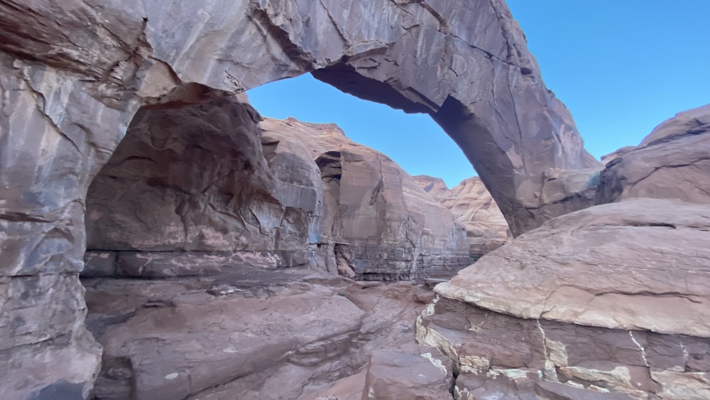 a large rock formation with an arch in the middle of it