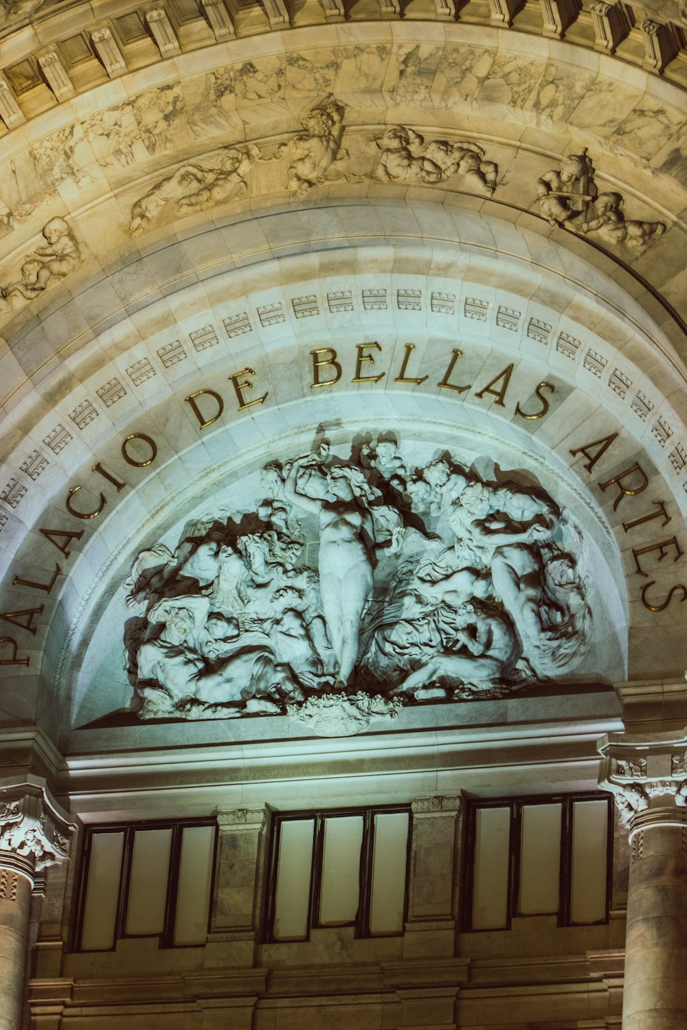 a large building with a clock on the front of it