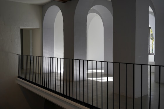 Modern hospital corridor with natural light and clean architectural lines.