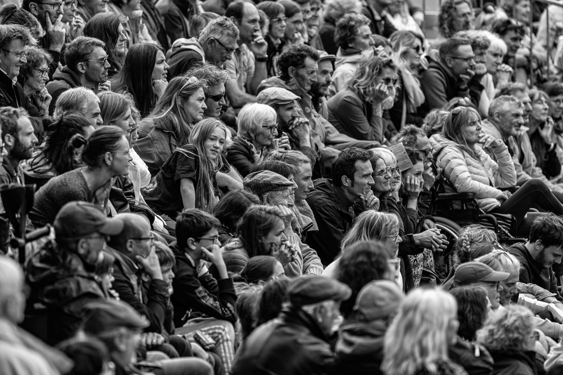 a large group of people sitting next to each other