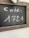 A small chalkboard with a rustic wooden frame displays the word 'code:' followed by the number '1721' written in white chalk.