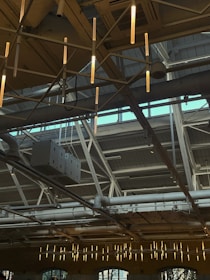 Wide shot of a freshly insulated warehouse ceiling with bright natural light.