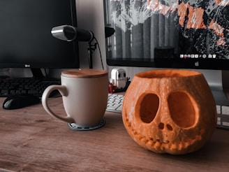 A spooky Halloween-themed tech setup with decorations.