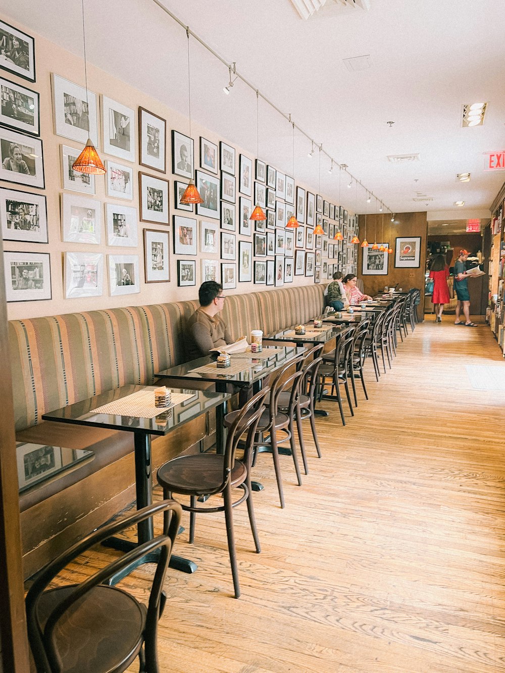 a person sitting at a table in a restaurant