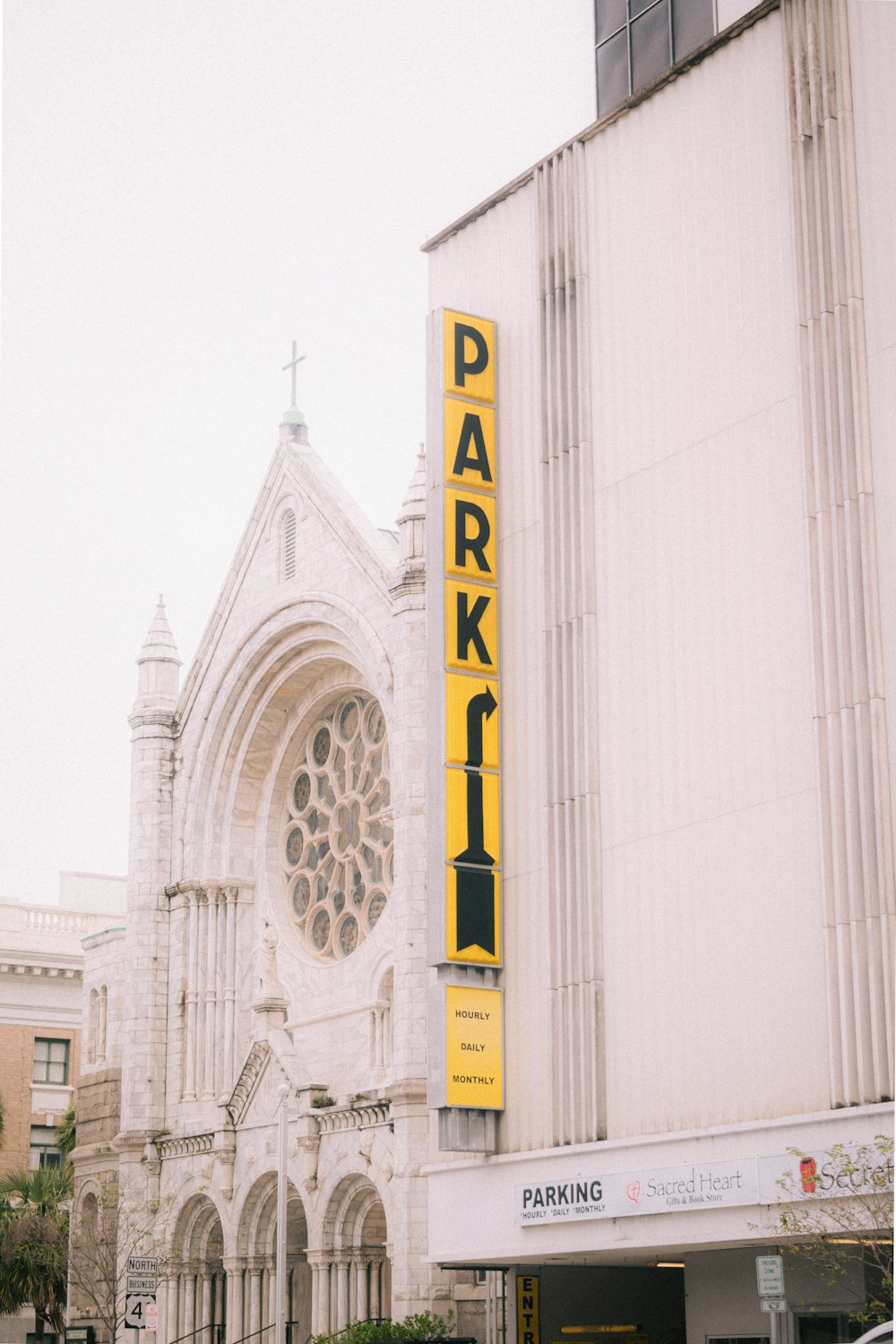 a large white building with a yellow sign on it's side