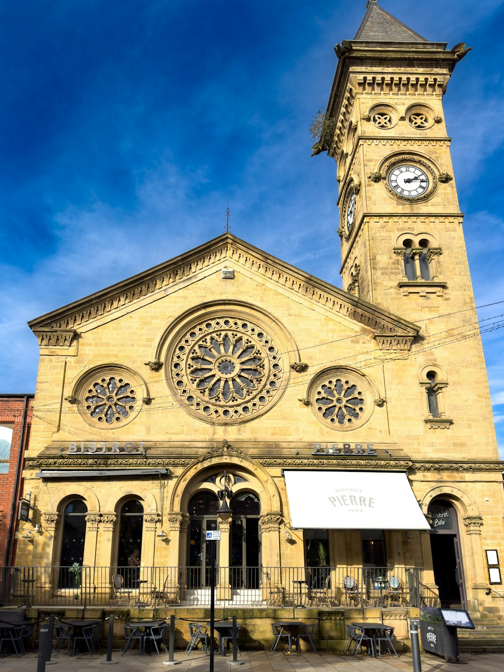 a large church with a clock tower on top of it