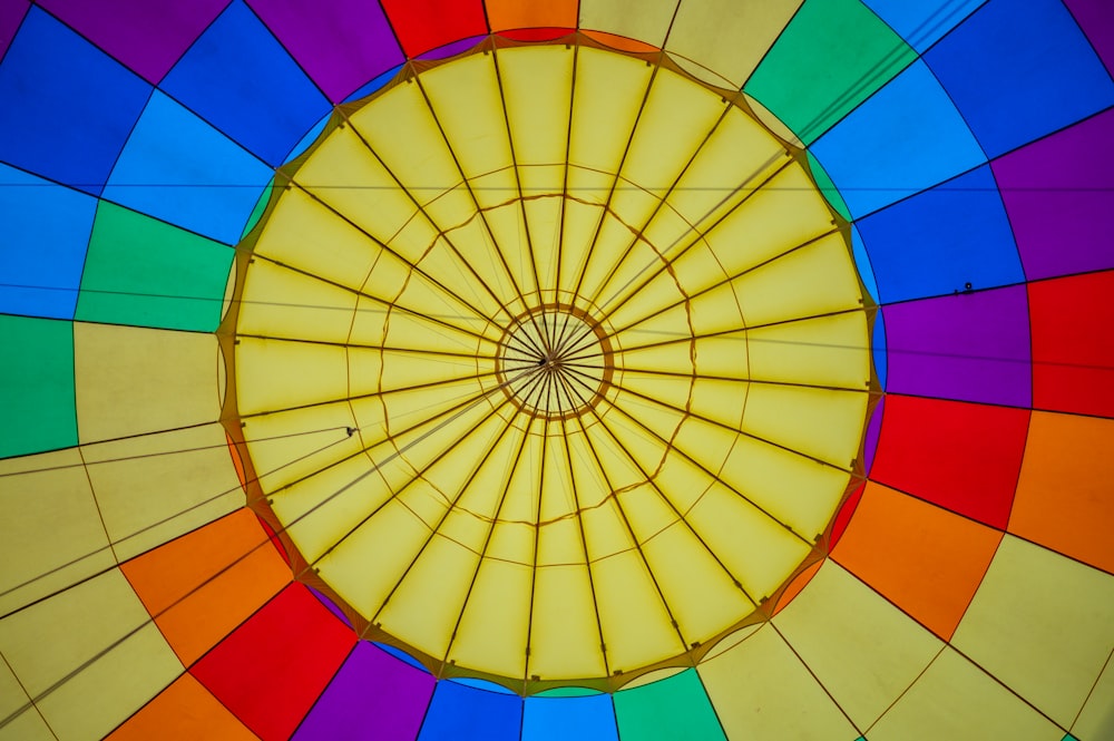 the inside of a colorful hot air balloon