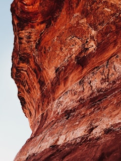 A close-up of textured rock formations illuminated by soft light.