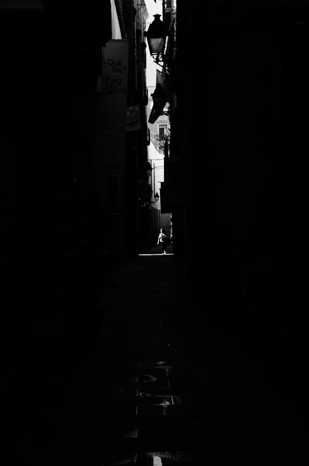 a black and white photo of a person jumping in the air