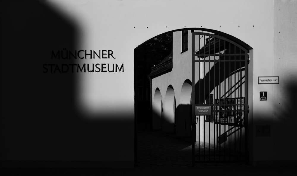 a black and white photo of the entrance to a museum