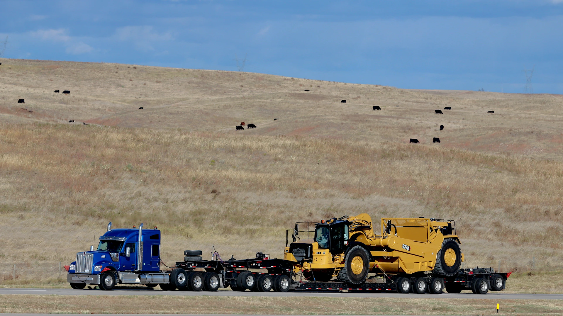 a semi truck hauling a tractor trailer down a road