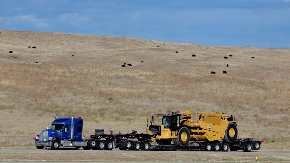 a semi truck hauling a tractor trailer down a road