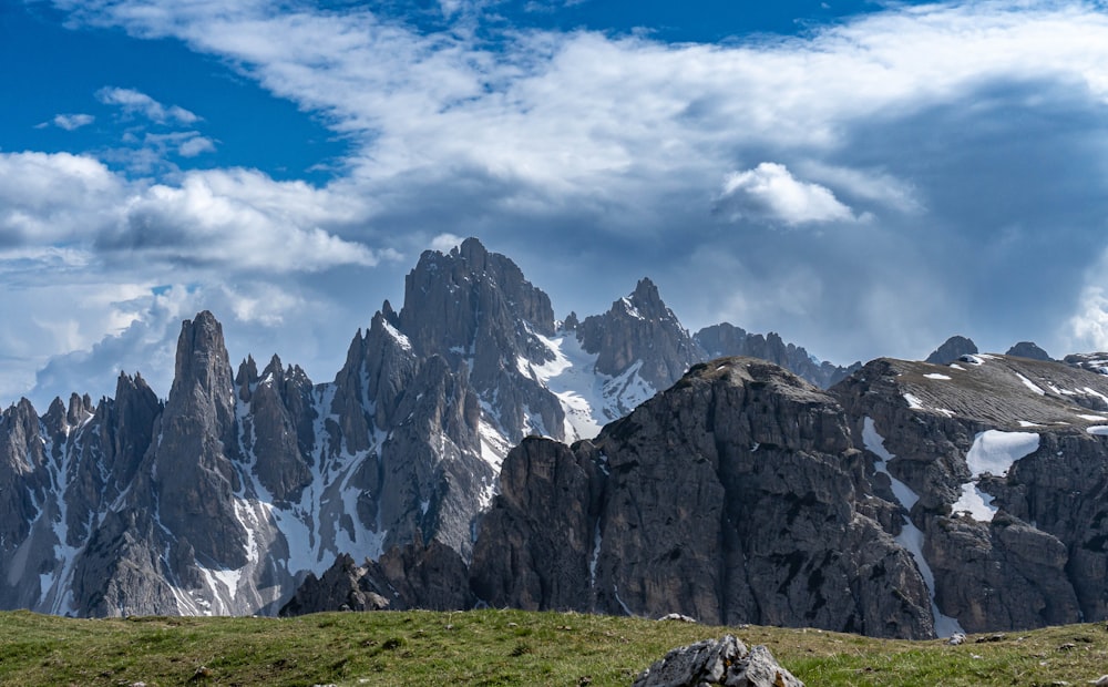 a mountain range with a few snow capped peaks