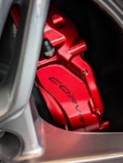 Close-up of custom brake calipers and rotors with Holley branding