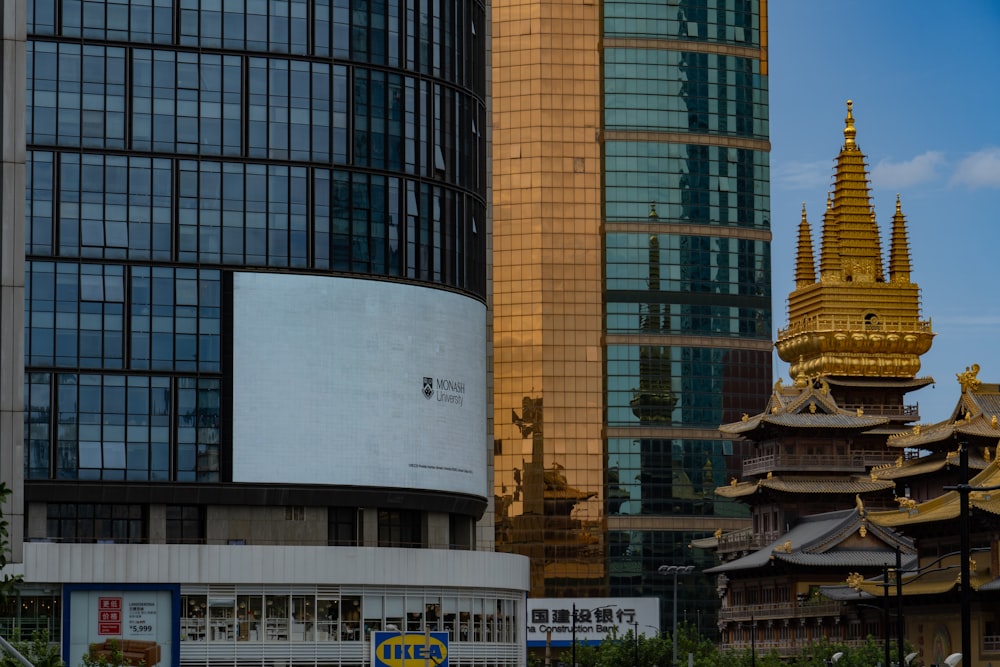 a tall building with a gold spire on top of it