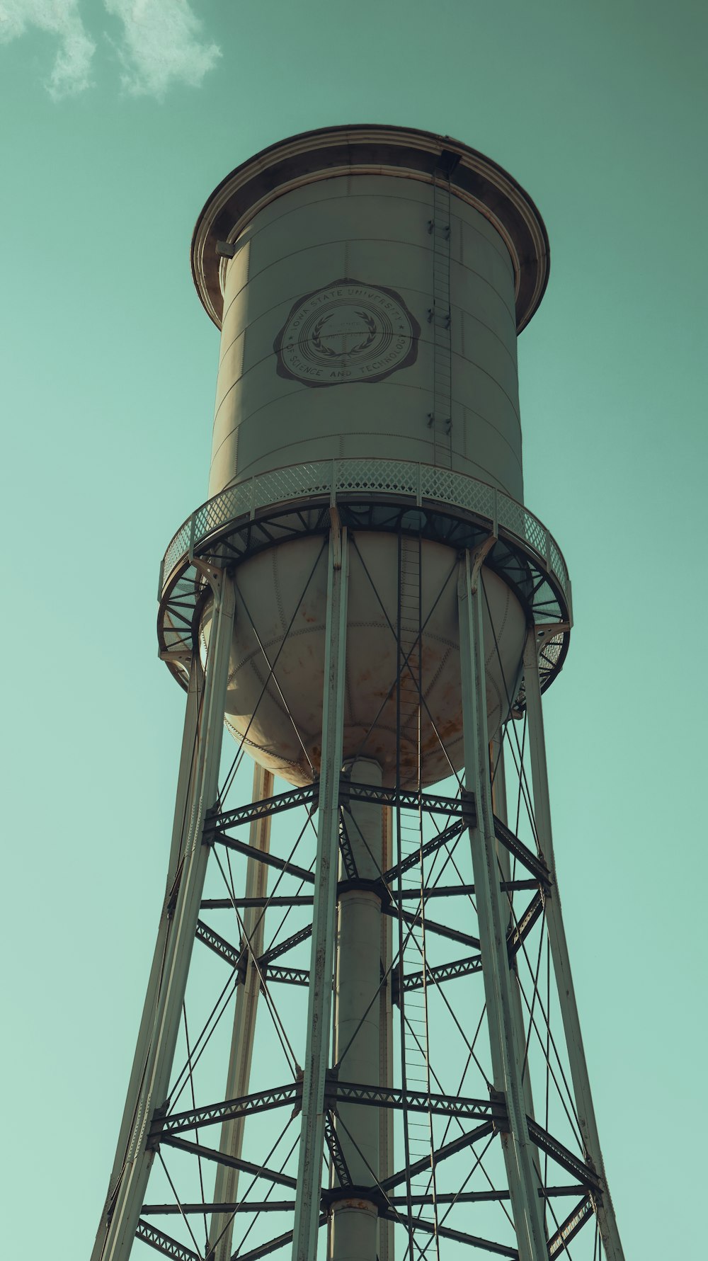 a tall water tower with a sky background