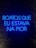 A neon sign displaying a phrase in Portuguese, illuminated in bright blue against a dark brick wall.