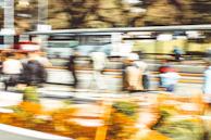 Video frame sequence with object tracking boxes following pedestrians in a smart city environment.