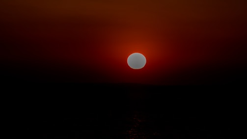 A still from a medium-length film showing a dramatic sunset scene with vibrant colors.