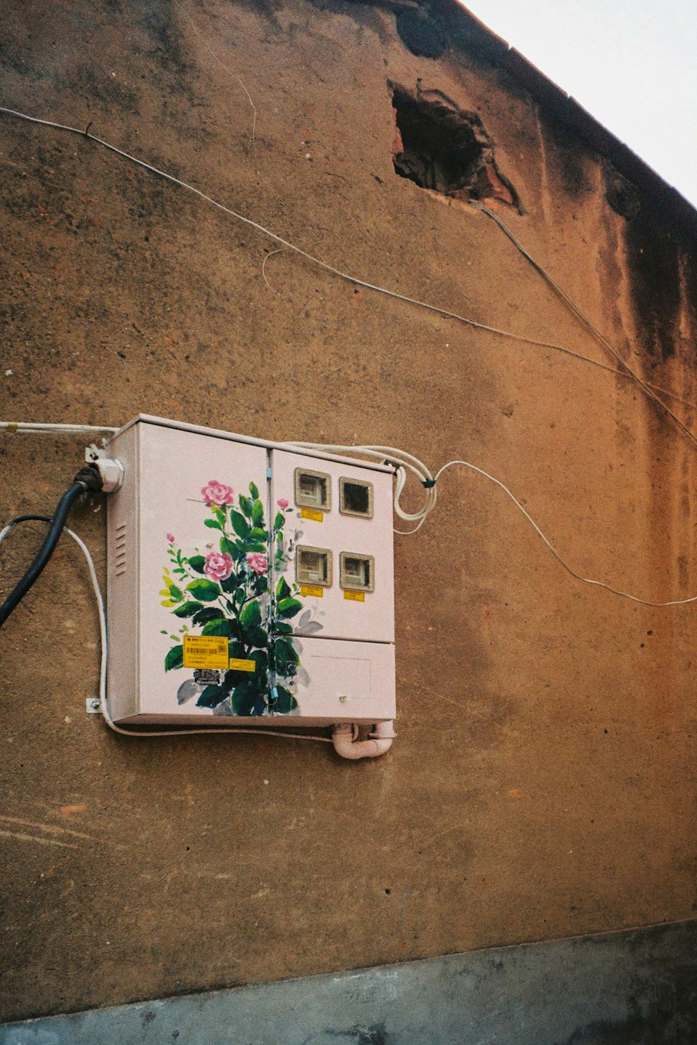 a white box with a picture of a plant on it