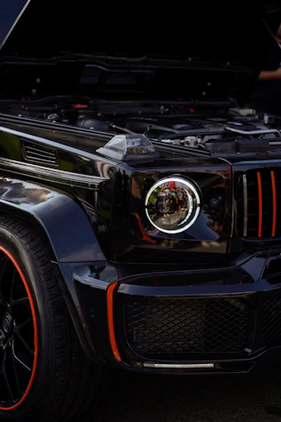 A modern SUV with highlighted parts for replacement and repair.