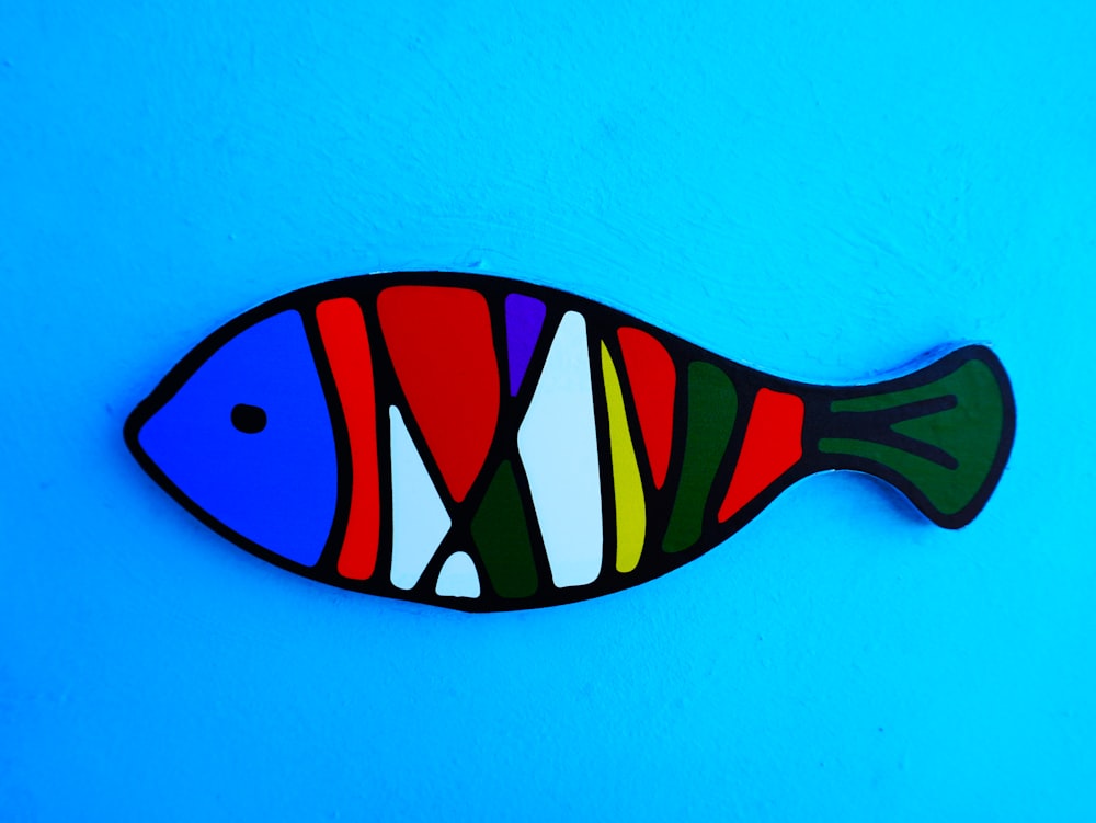 a painting of a fish on a blue background