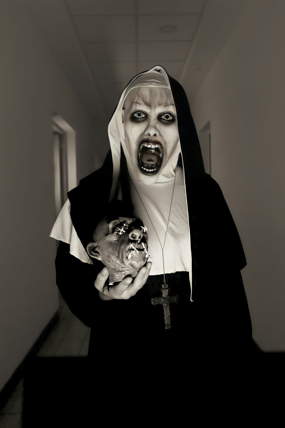 a nun holding a cat in a hallway