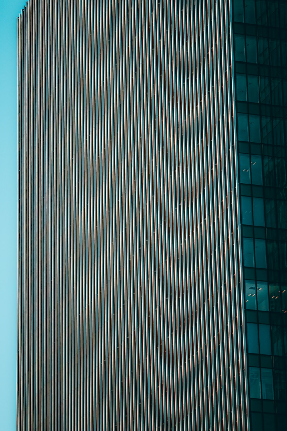 a very tall building with a clock on it's side