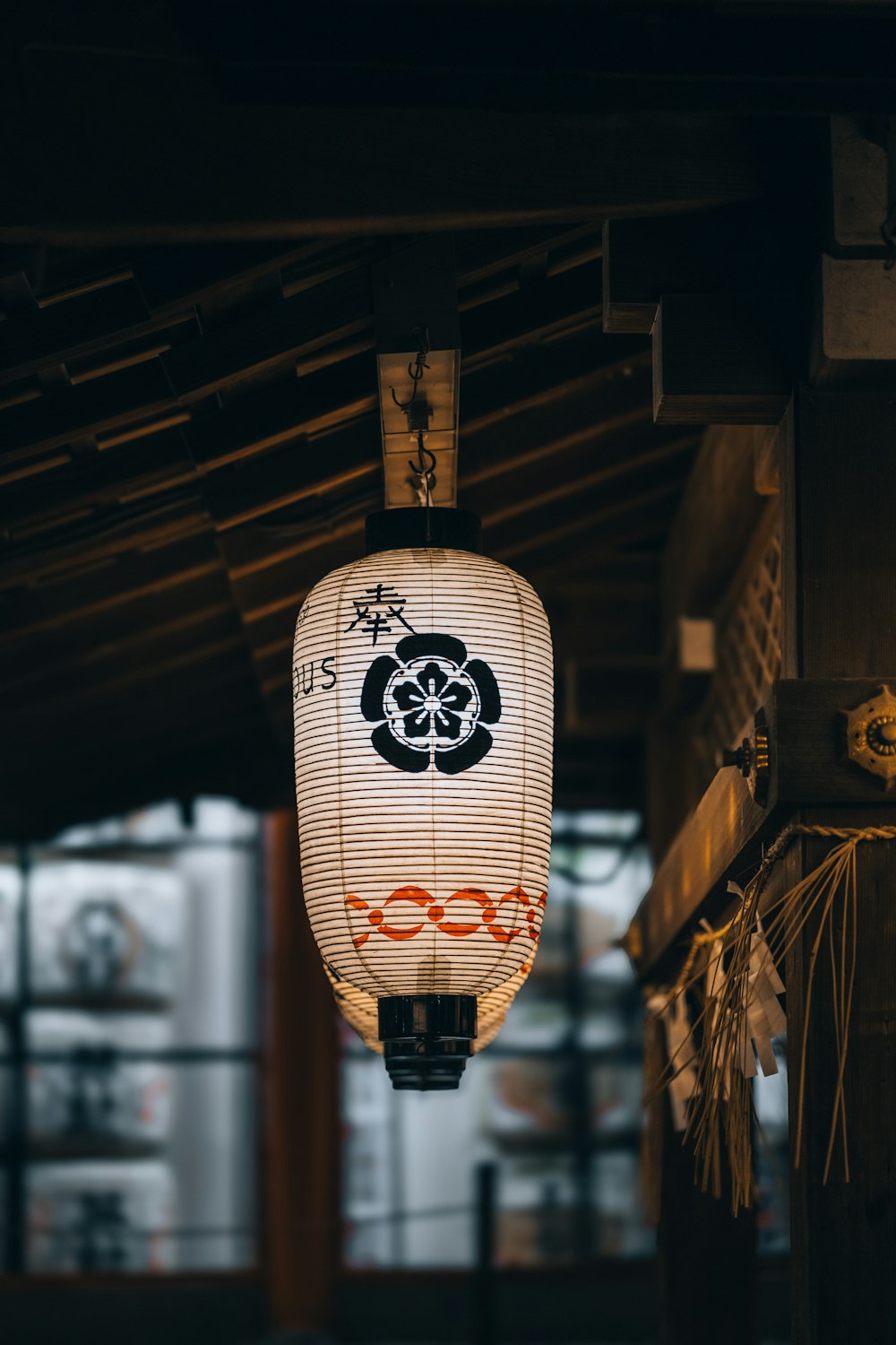 a lantern hanging from the ceiling of a building