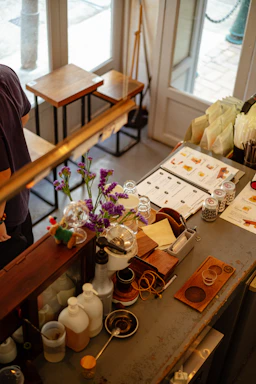 Cozy café counter with fresh juices and tea cups on display