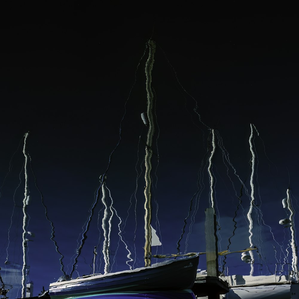 a row of boats sitting on top of a body of water