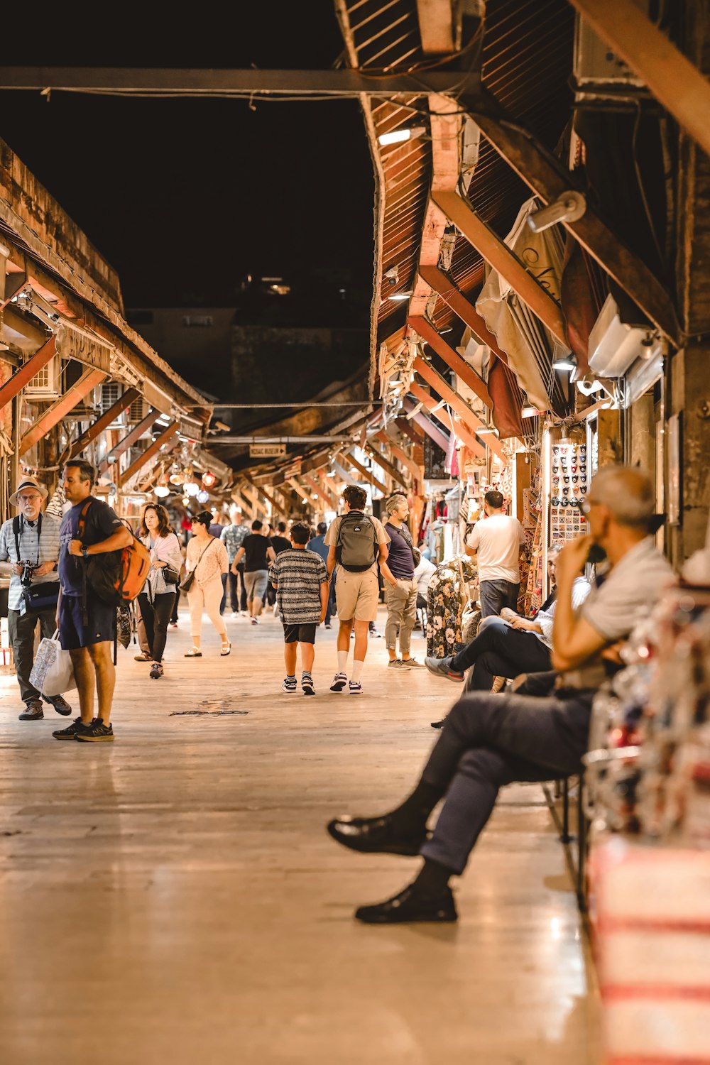 a group of people standing and sitting in a building