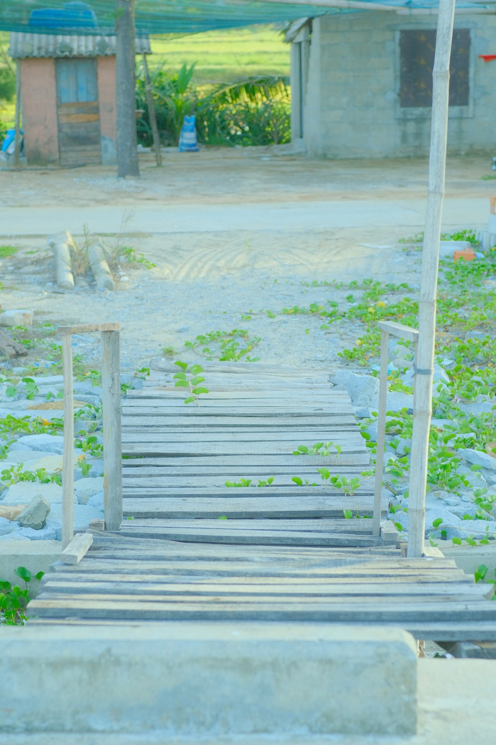 a wooden walkway with a stop sign on top of it