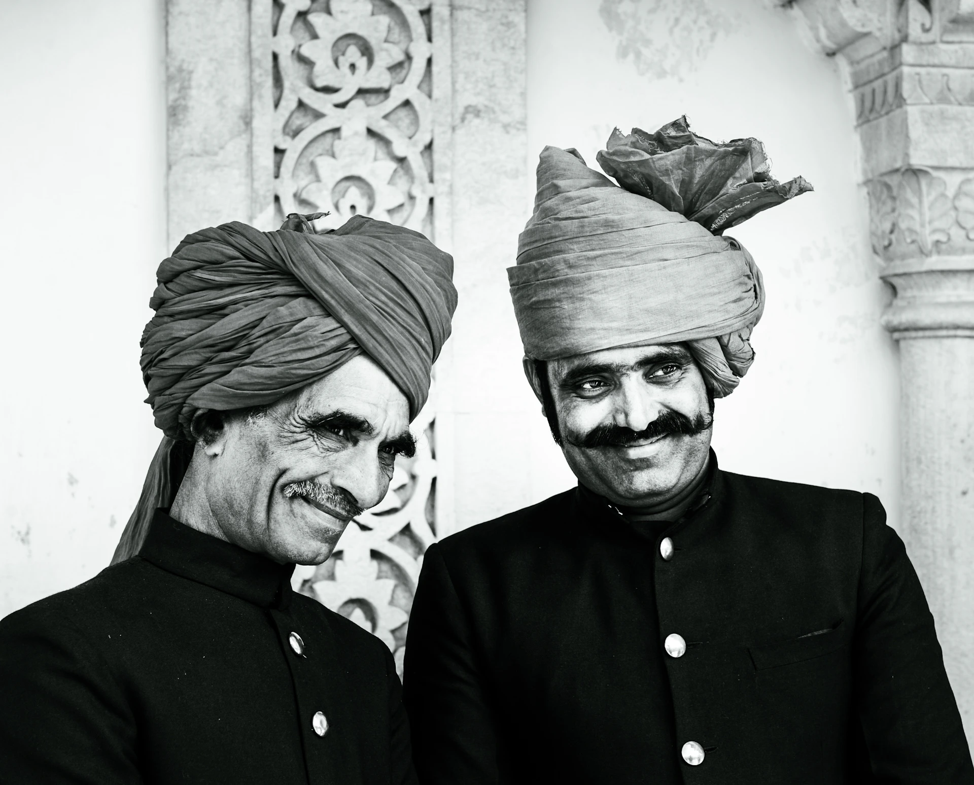 a couple of men standing next to each other