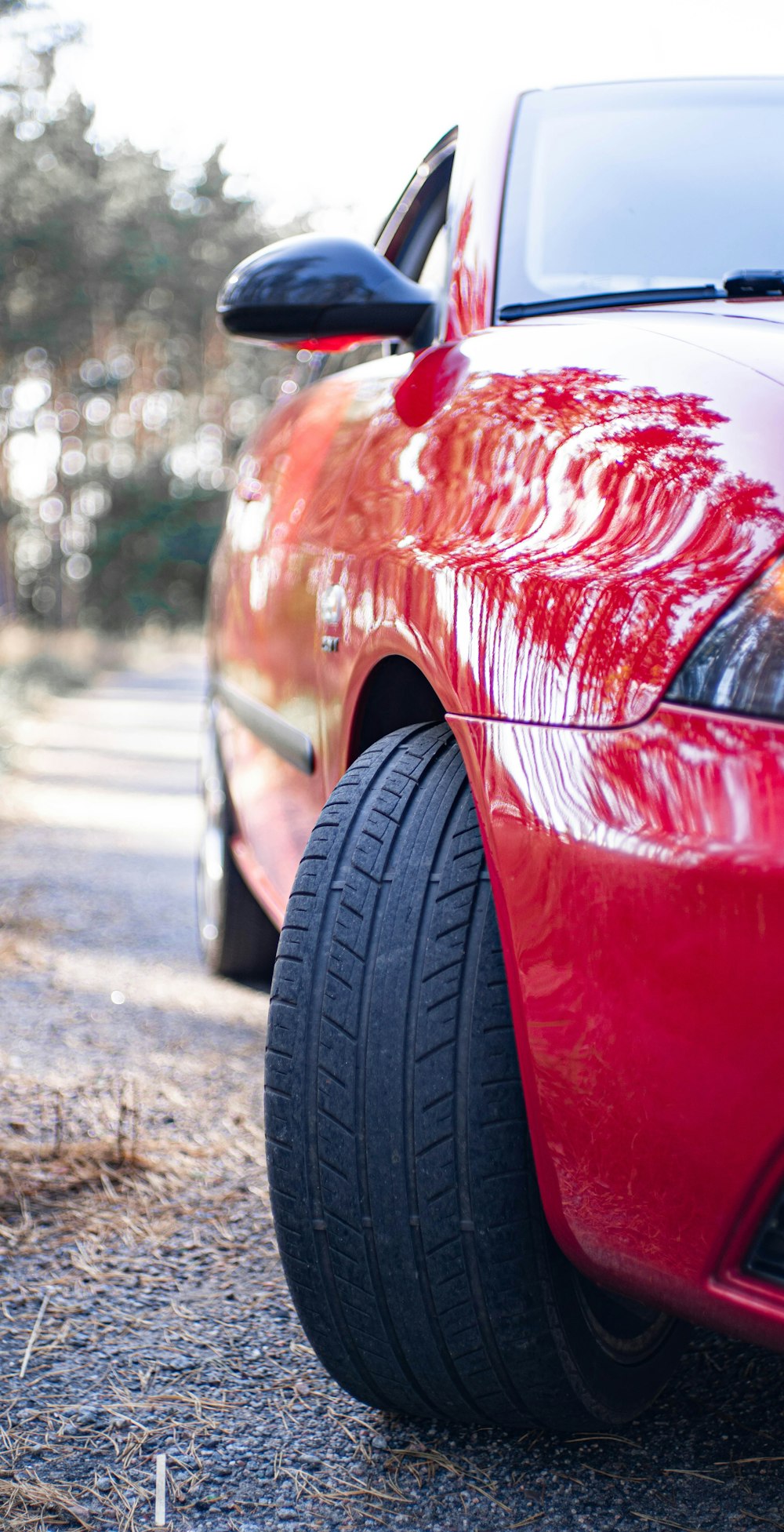 a red car parked on the side of the road