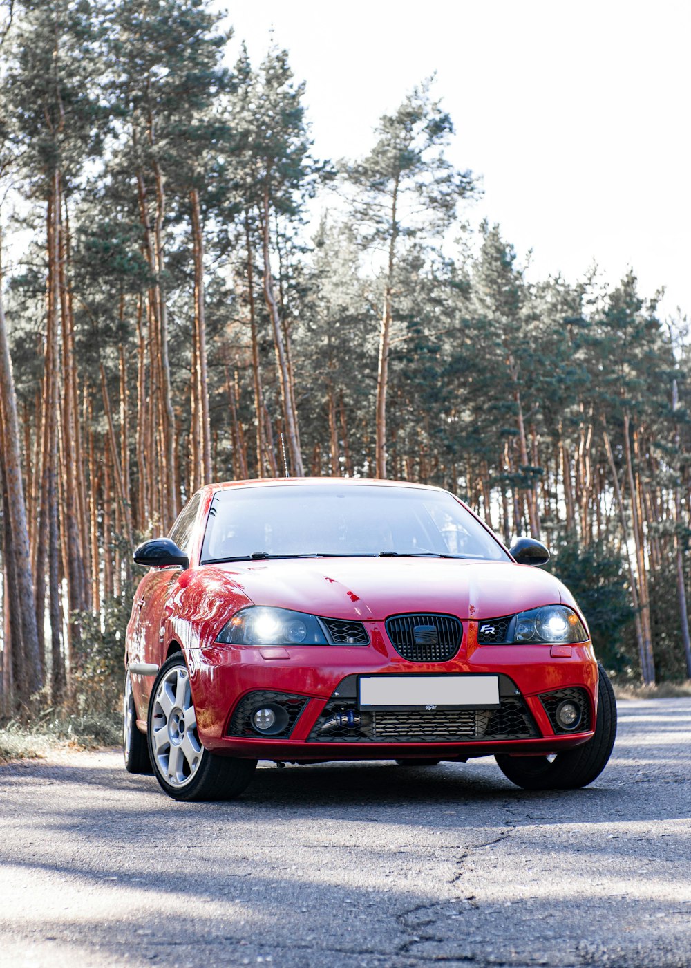 a red car parked on the side of the road