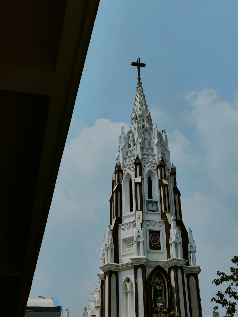 a church steeple with a cross on top