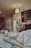 A rustic display of assorted pastries and coffee drinks on a café counter.
