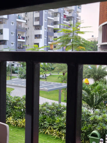 A panoramic view of a modern residential complex developed by Nexavita, showcasing green spaces and contemporary architecture.