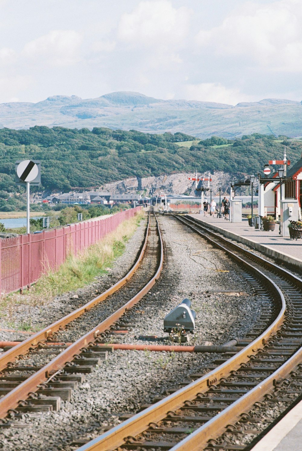 a train station with a train on the tracks