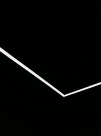 Minimalist black-themed landing page with a prominent blue call-to-action button.