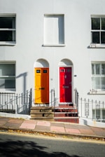 a couple of doors that are on the side of a building
