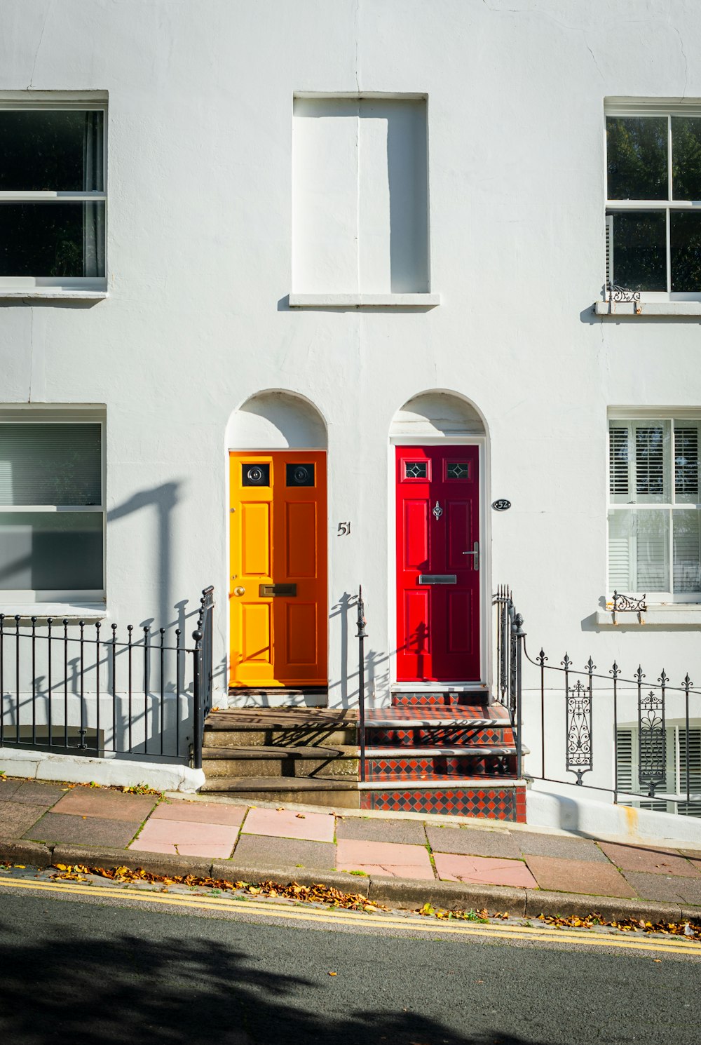 a couple of doors that are on the side of a building