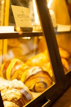 A cozy bakery counter with fresh banana pastries displayed invitingly.