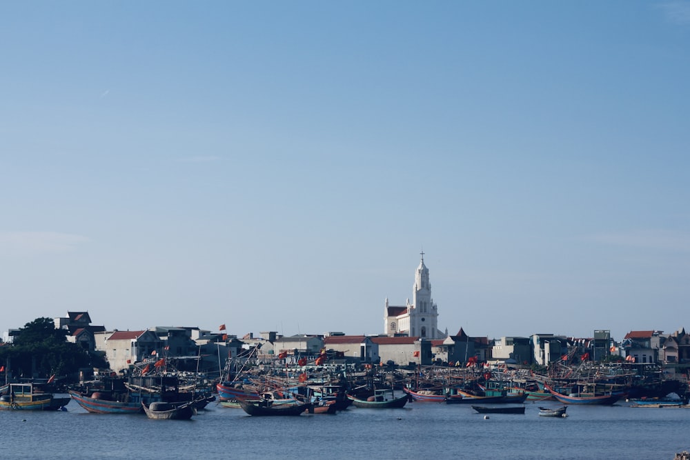 a group of boats floating on top of a body of water