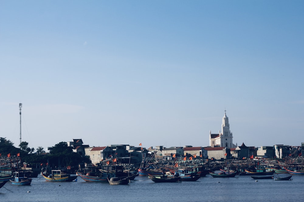 a group of boats floating on top of a body of water