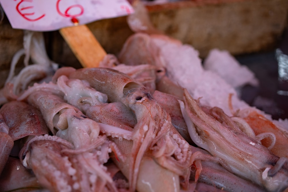 a pile of meat sitting on top of a pile of ice