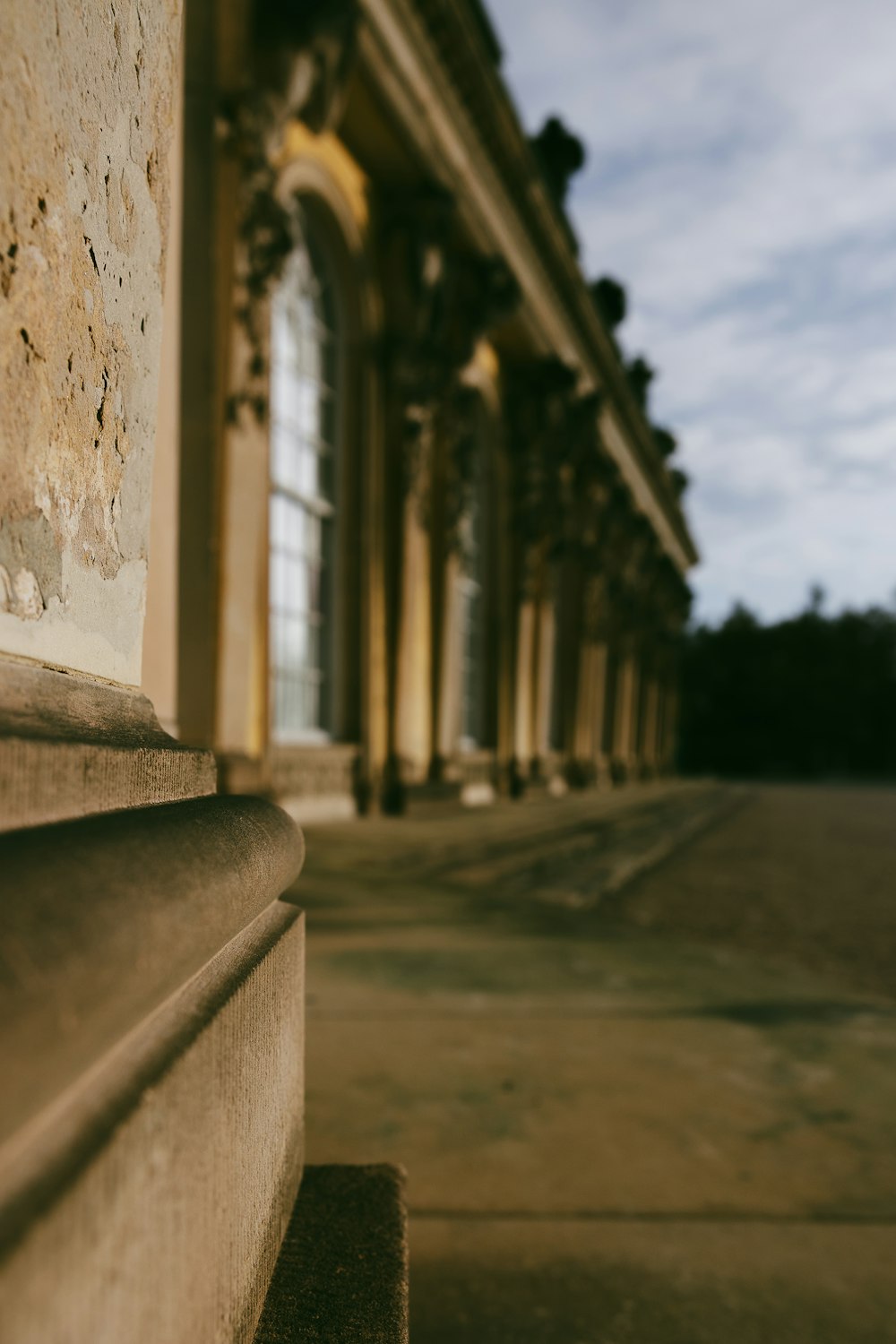 a close up of a bench near a building